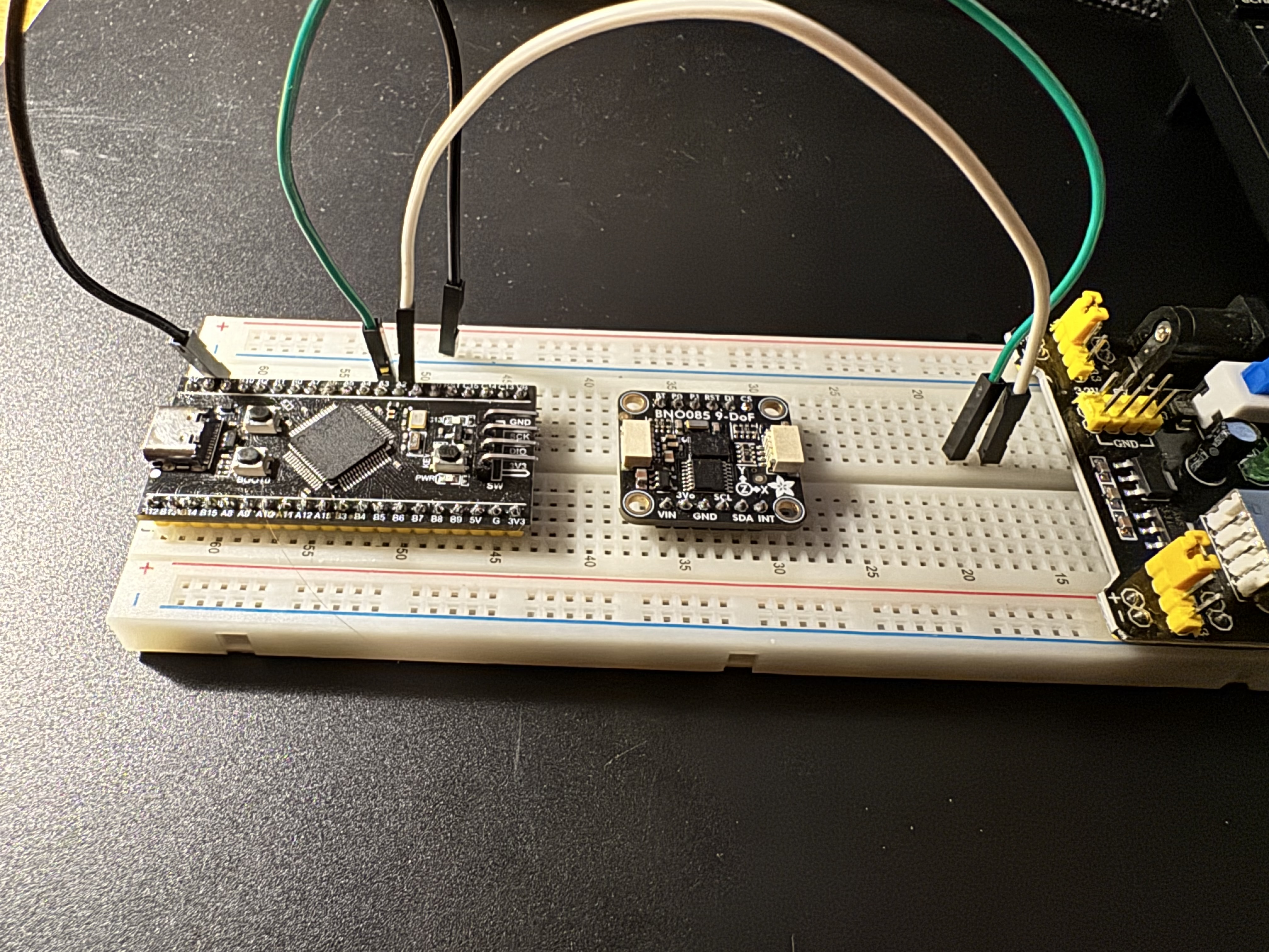 STM32 dev board wired to a BNO085 9-axis IMU on a breadboard